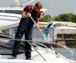 Man cleaning a boat